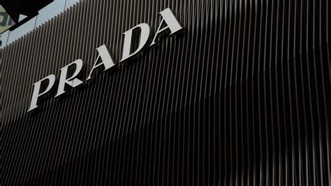 prada held|Prada clothing company.